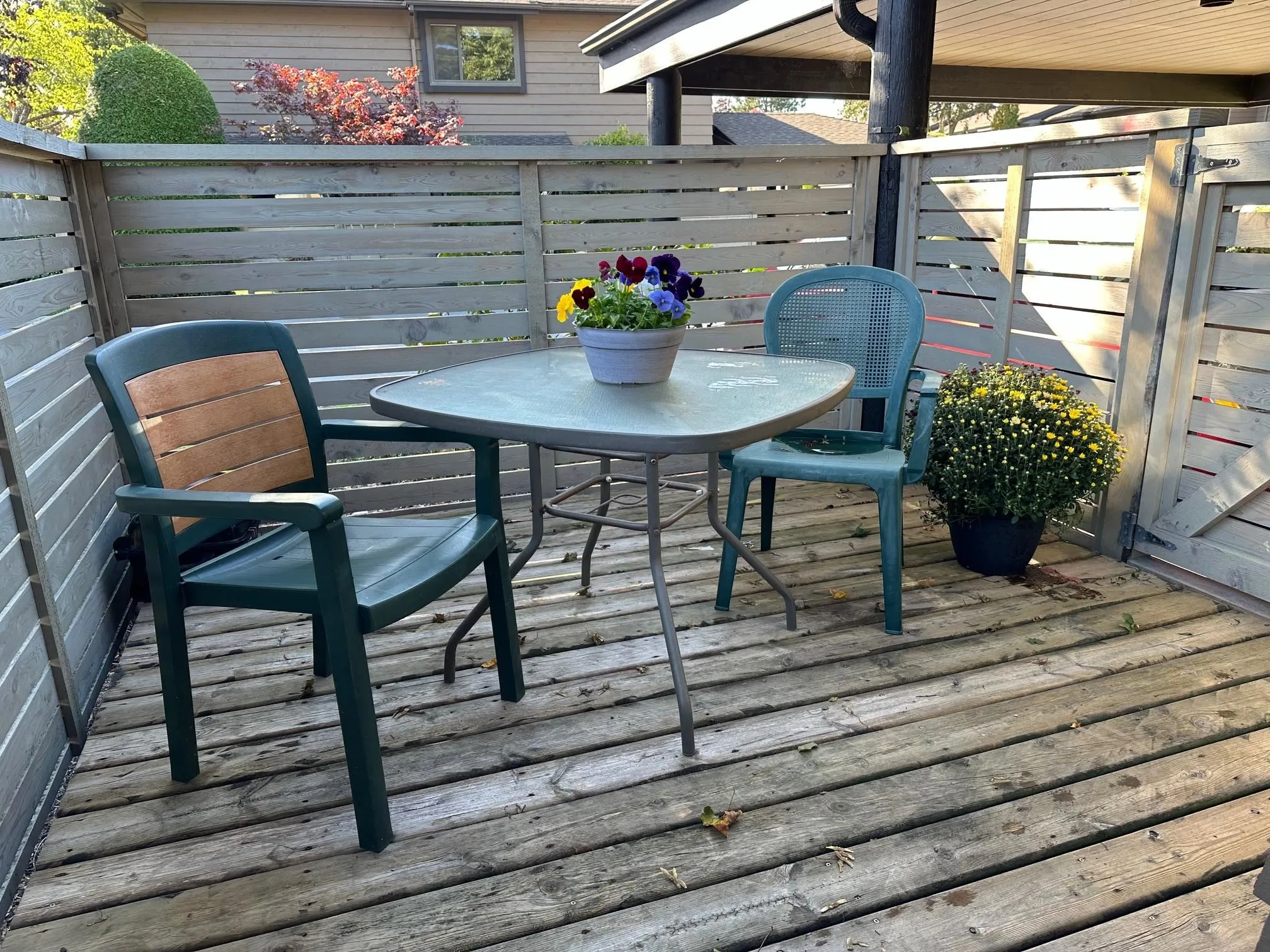 Two outdoor areas mean you can choose whether to sit in the sun or shade. This is the south-facing private deck off the family room/kitchen in morning light.