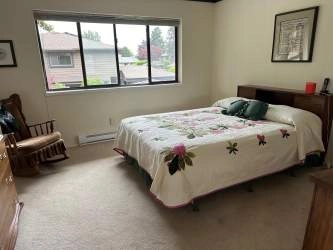 The main floor powder room is located off the entrance and even has a window.