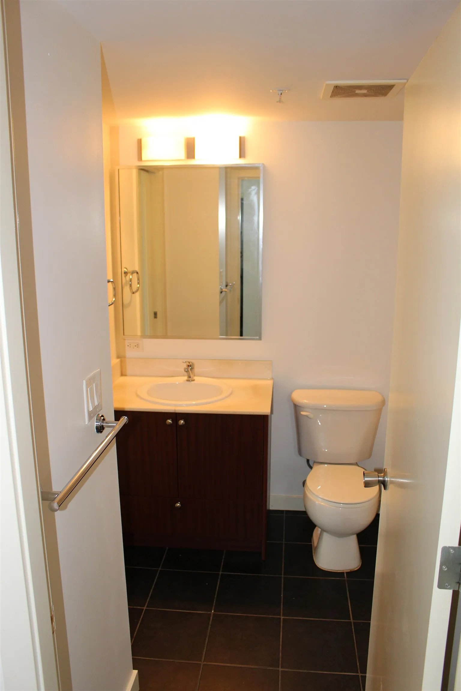 Full bathroom connected to walk-in closet and corridor for guest access. Privacy pocket door available.