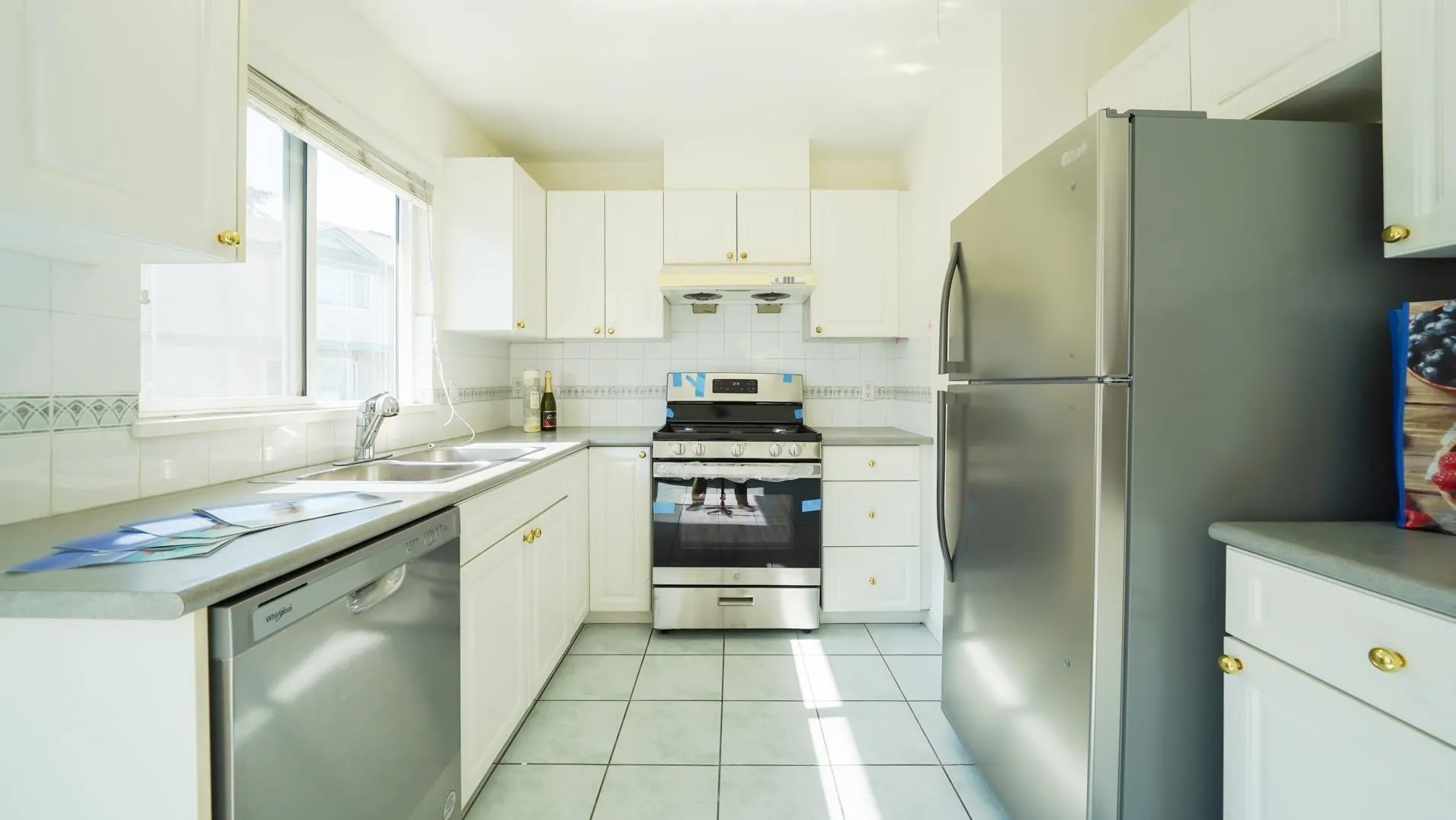 New stainless steel appliances waiting for you to take the tape off!