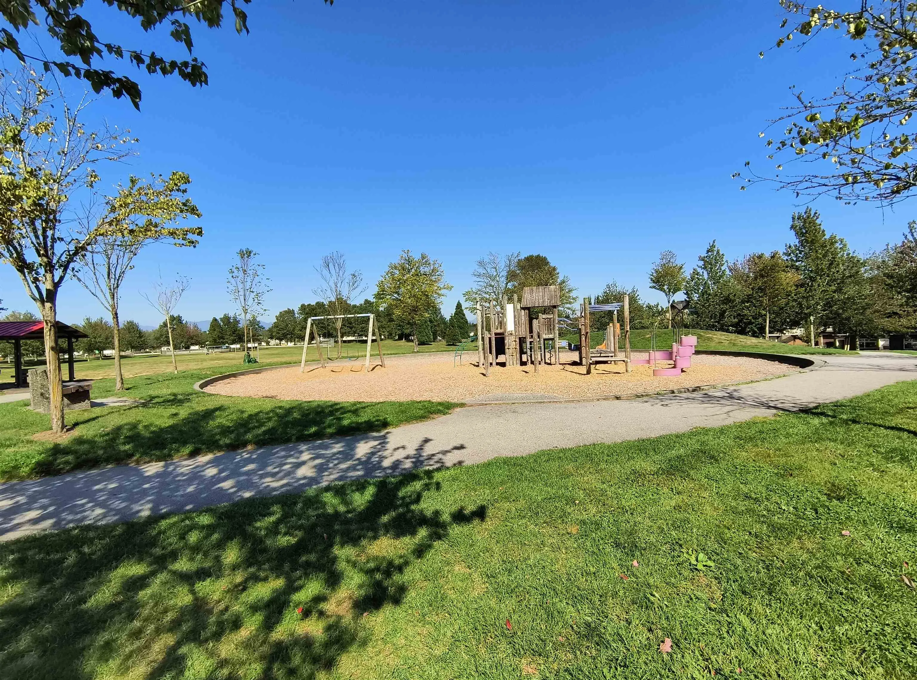 Another huge lovely park - now with a dog park, community garden, basketball court, hockey rink, covered area for the playground and so much more!