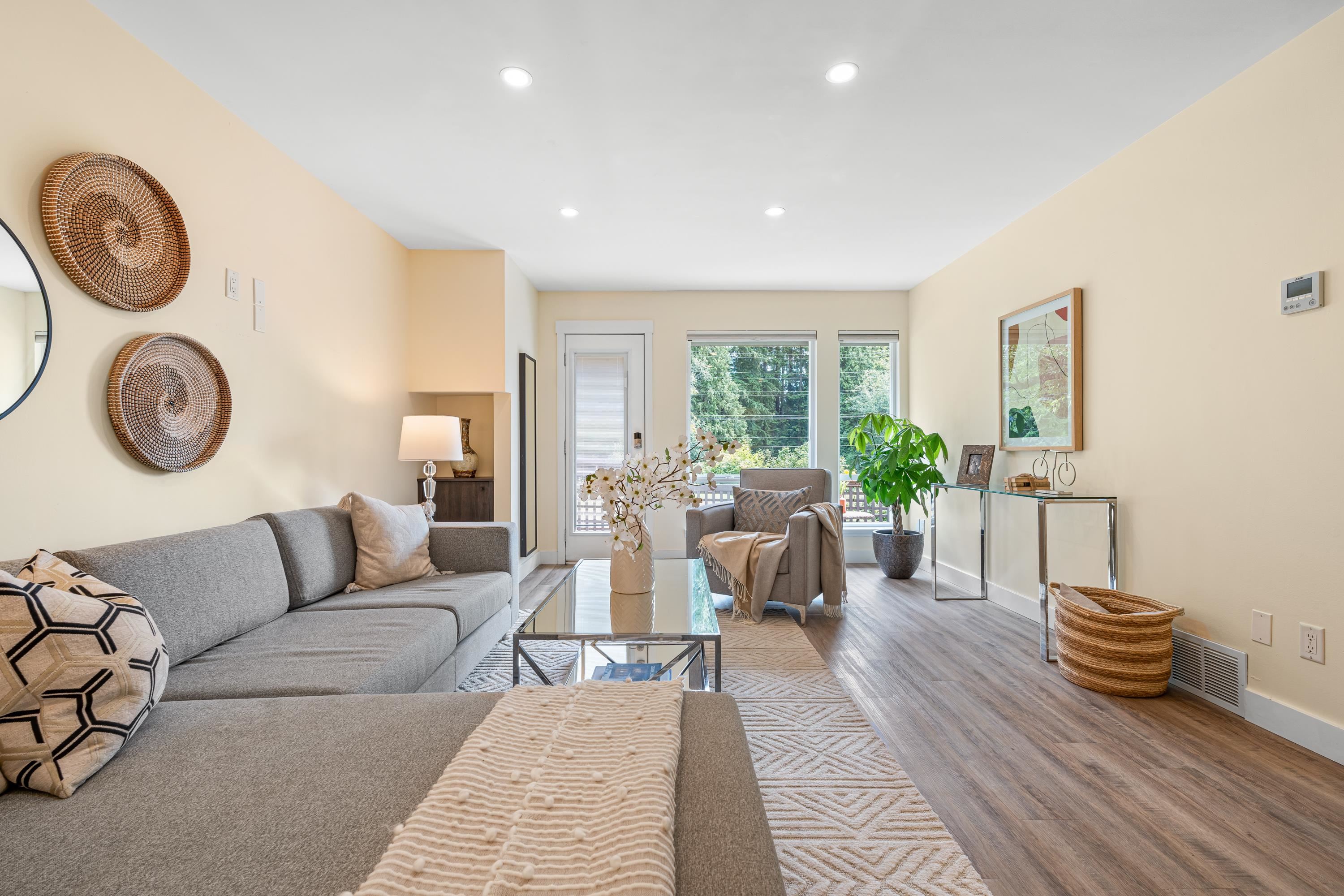 LARGE LIVING ROOM LEADING TO SUNDECK AND MASSIVE LAWN AND GARDENS