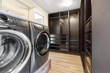 MASSIVE WALK IN CLOSET WITH LAUNDRY AND A WINDOW!