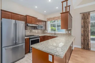 Wirth a spacious granite countertop and breakfast bar.