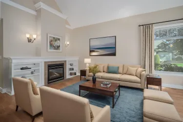 Living room with gas fireplace. Virtually staged.