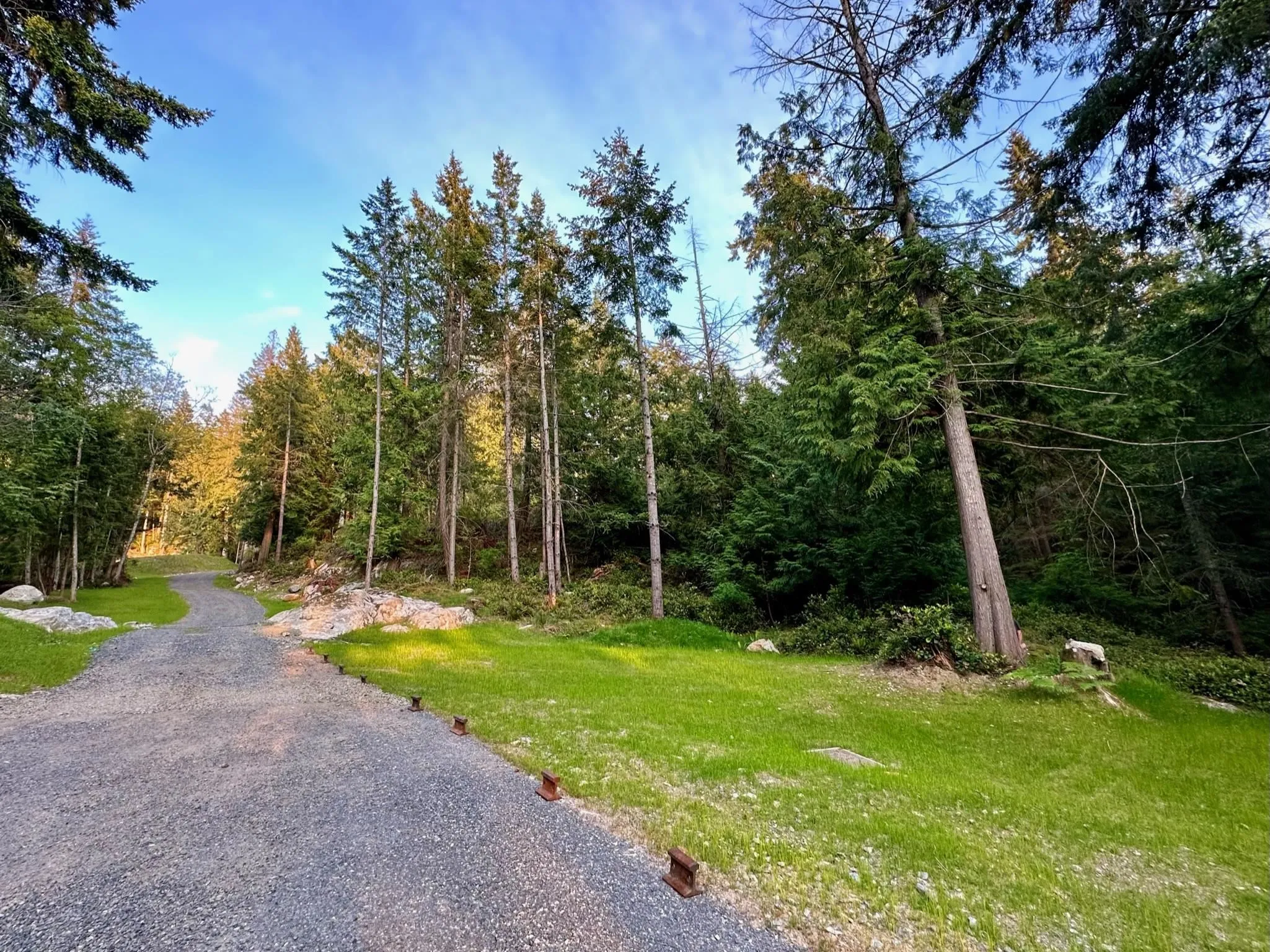 A large flat area near Windjammer provides additional parking and access to the lower level of the property ideal for a separate accessory building or cabin.